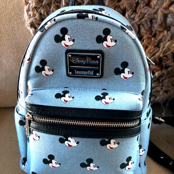 Loungefly Handbags - Disney Loungefly denim backpack. NWOT condition!!!